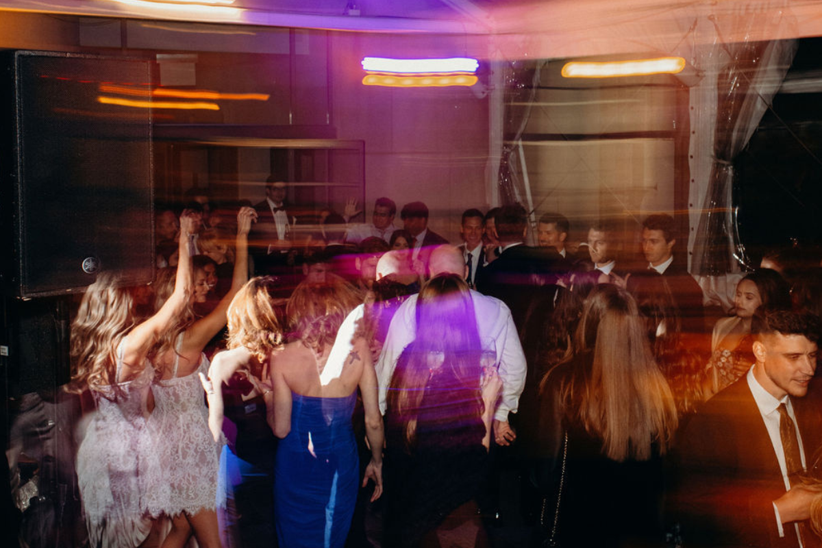 A bunch of people all dancing on a dance floor