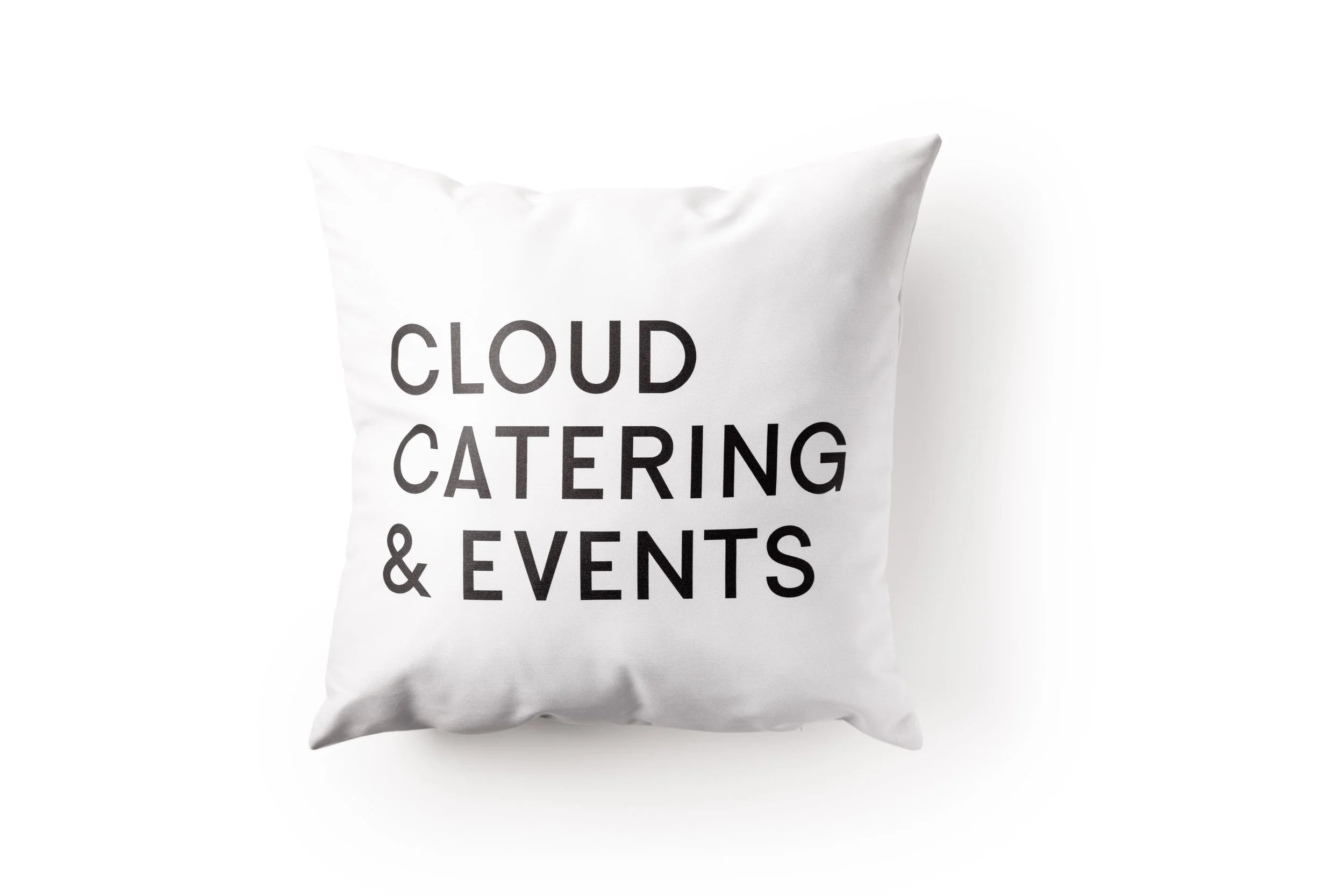 White pillow with black text reading "Cloud Catering & Events" on a white background.