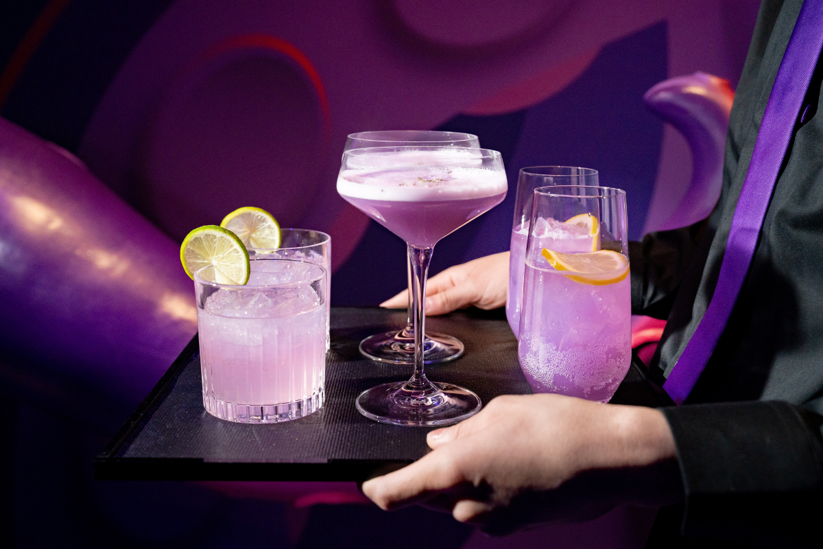 A platter of drinks that is server is carrying around