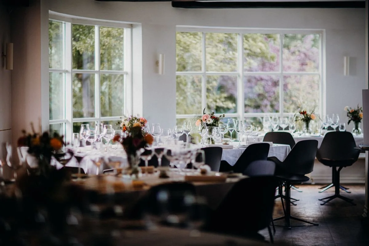 A wedding venue with some tables set up
