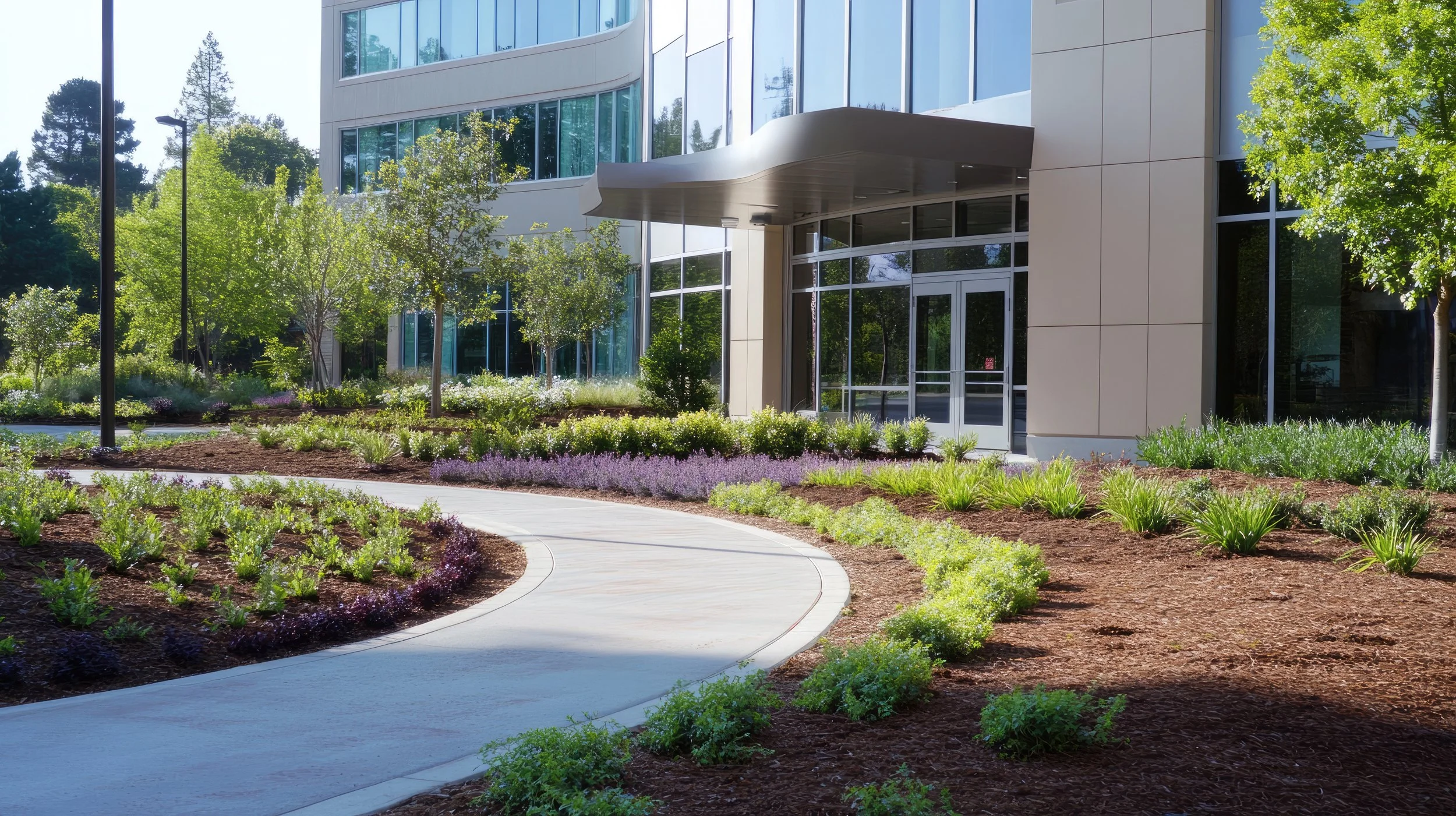 Curved concrete sidewalk in front of a large commercial office space in Columbus, Ohio.