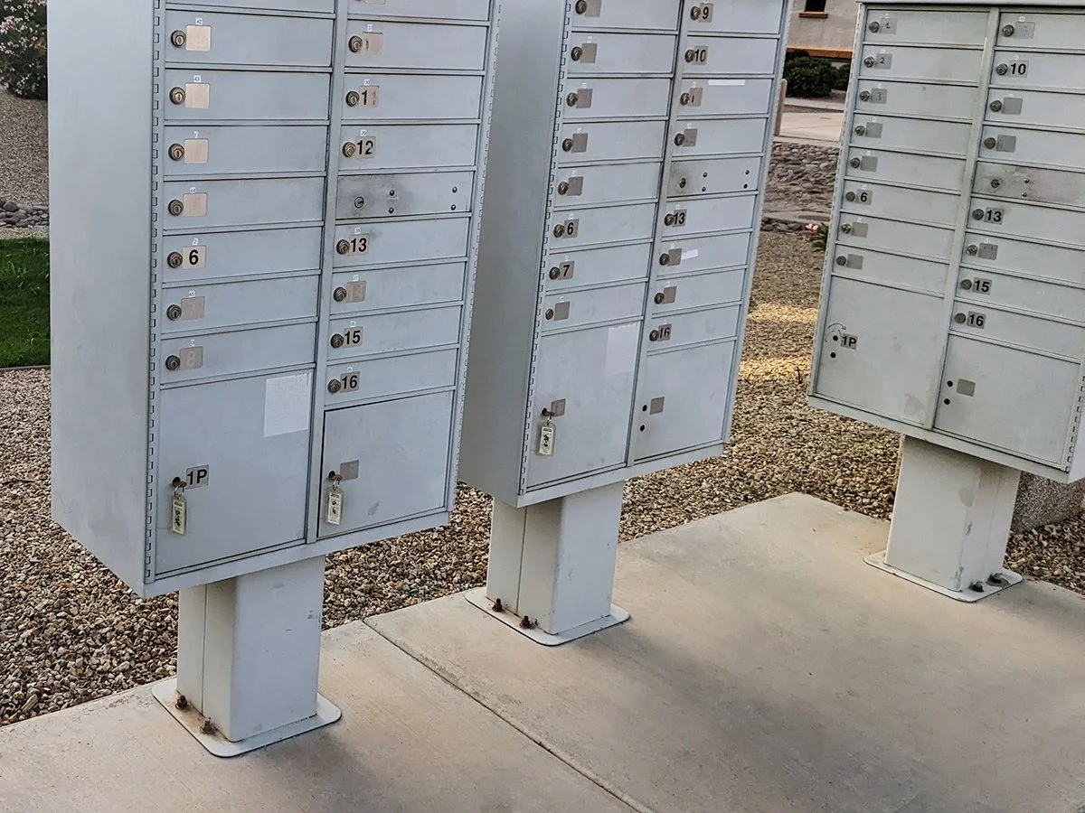 Concrete pad under an apartment building mailboxes.