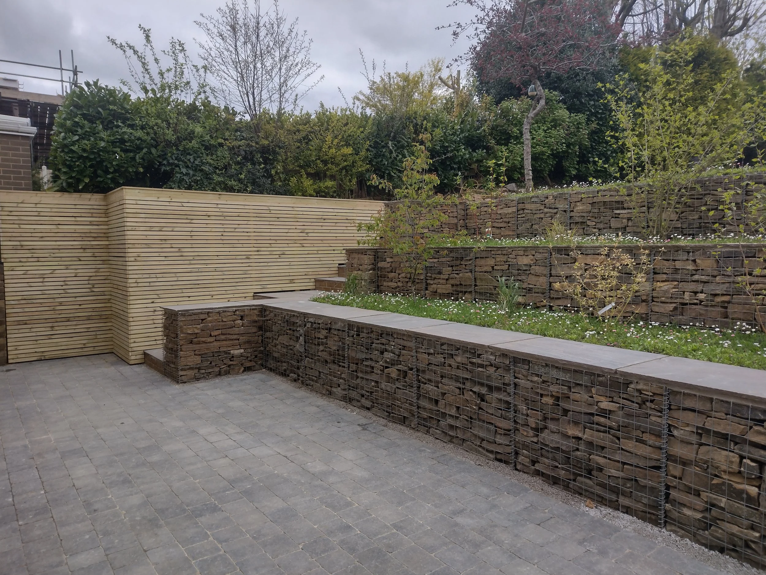 Gabion baskets make a bold structural statement but will blend in to the background when the meadow is in bloom.