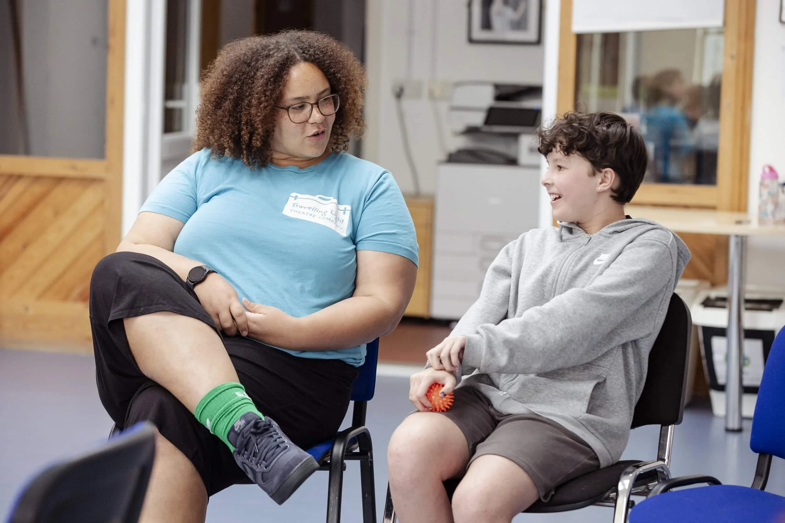 Facilitator and child at a theatre workshop