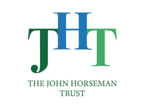 The John Horseman Trust logo - a capital J in green, a capital H in blue and a capital T in light green.