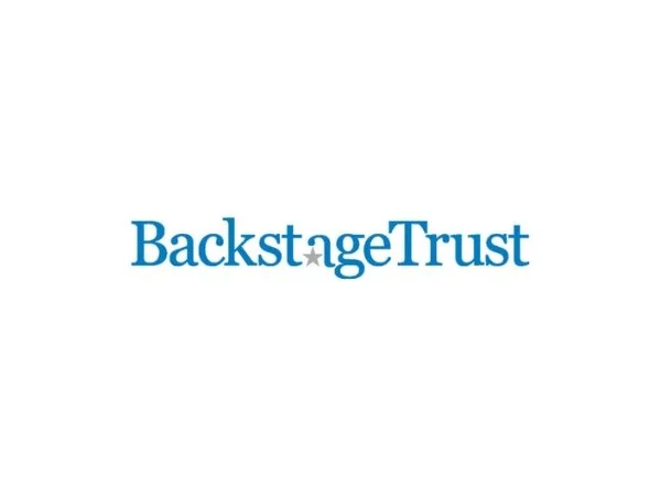 Backstage Trust logo in blue writing with a small grey star forming part of the 'a' in the name