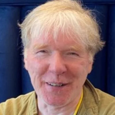 A headshot of Patrick Dineen