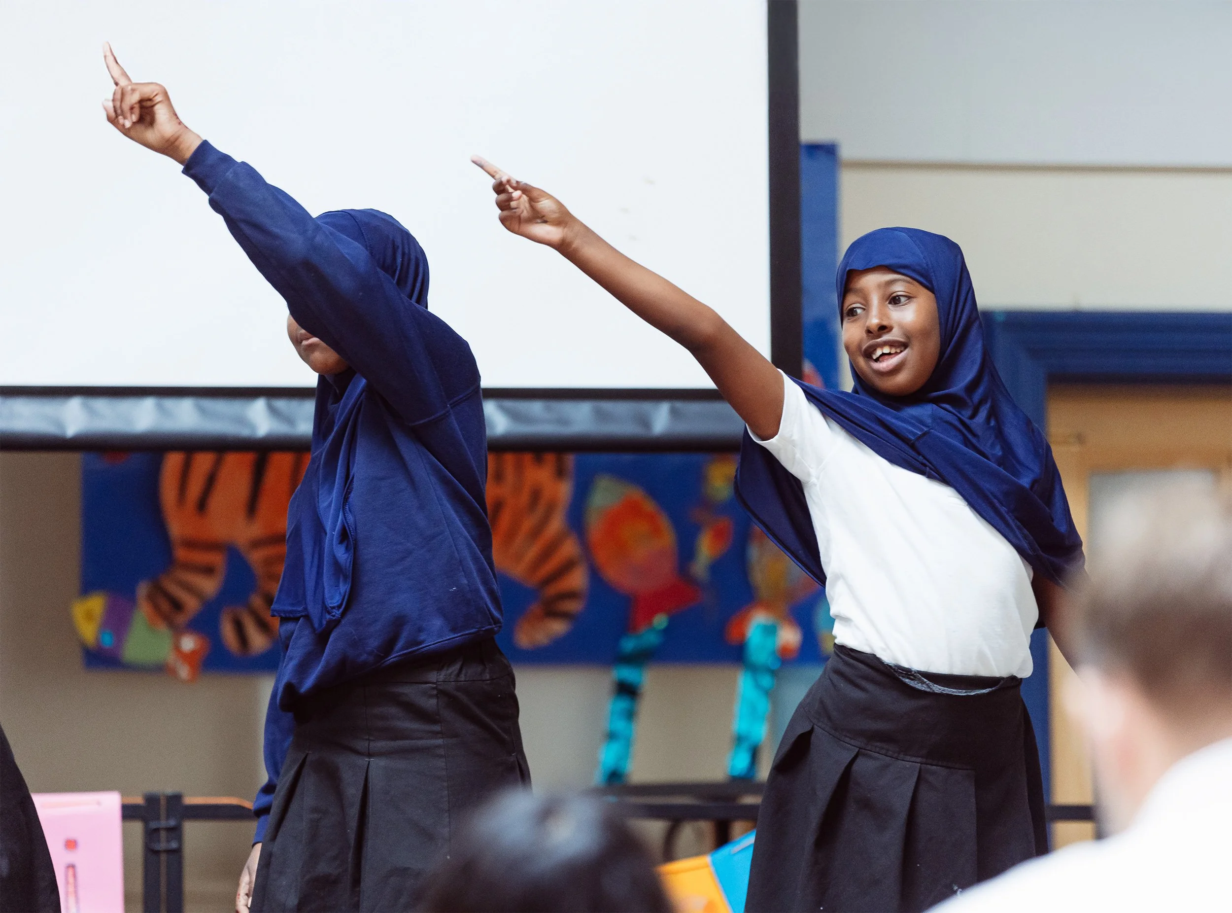 Two young people enjoying interactive theatre