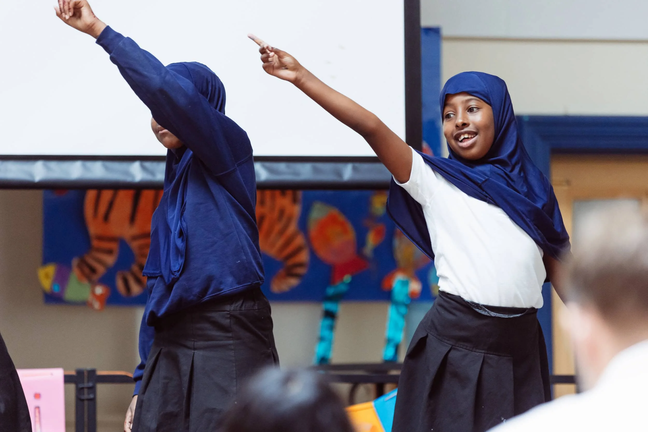 Two children at school enjoying our theatre activity