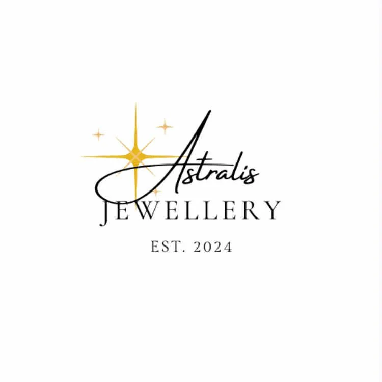 Logo for Astralis Jewelry with a gold star and the name in black cursive, established in 2024