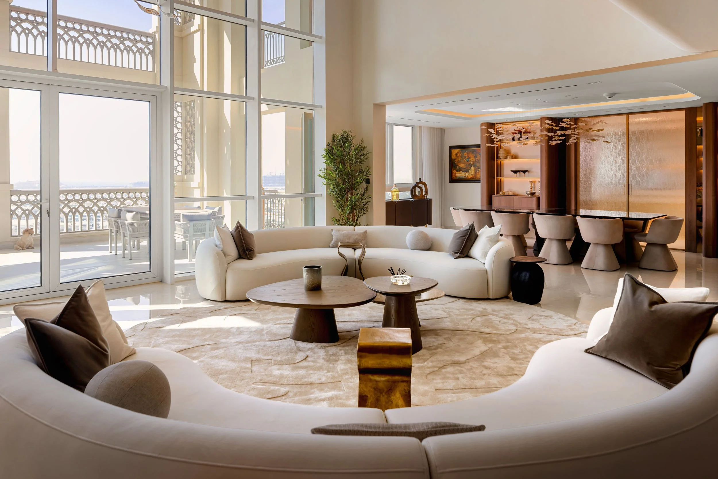 Interior photography of a modern luxury home with sculptural furniture, warm materials, curated styling, and architectural detailing.