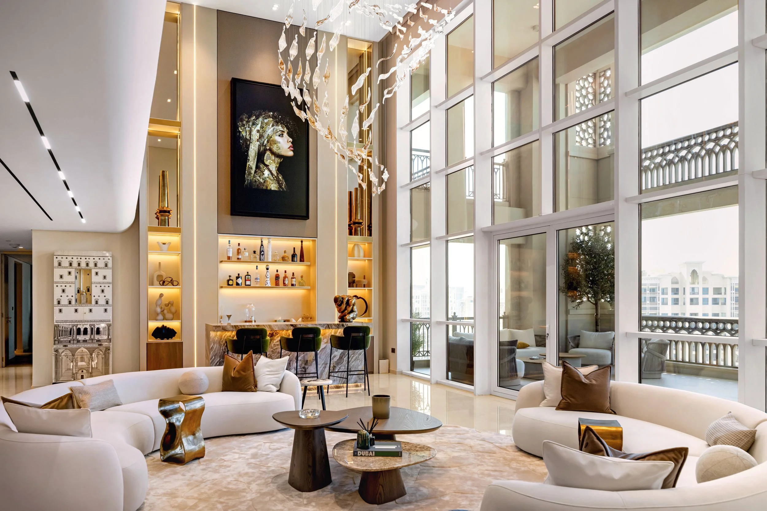 Luxury residential interior photography in Dubai featuring a bright living room, layered seating, natural light, and refined contemporary design.