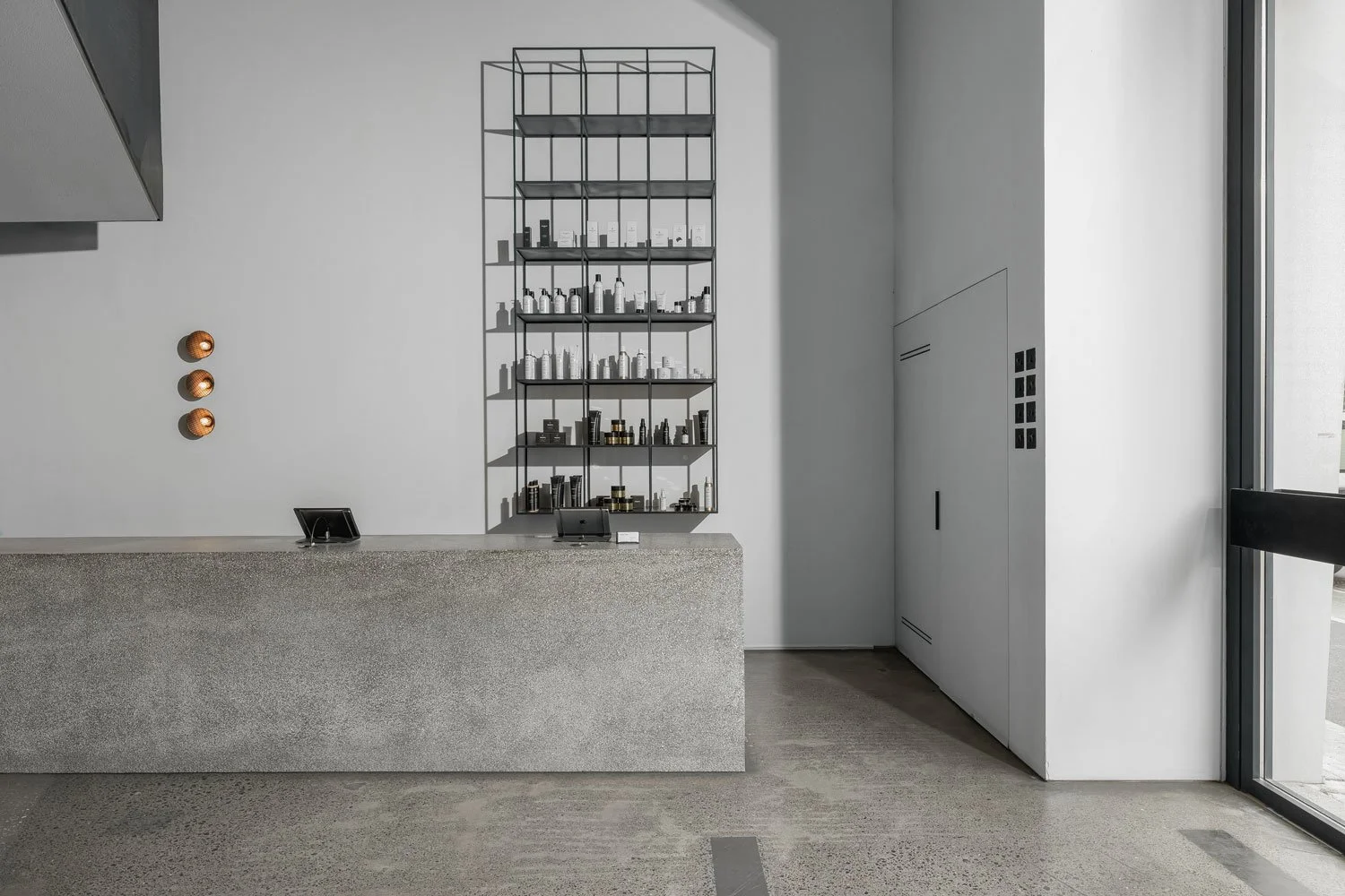 Reception area photography highlighting modern commercial interiors, custom lighting, and premium architectural finishes.