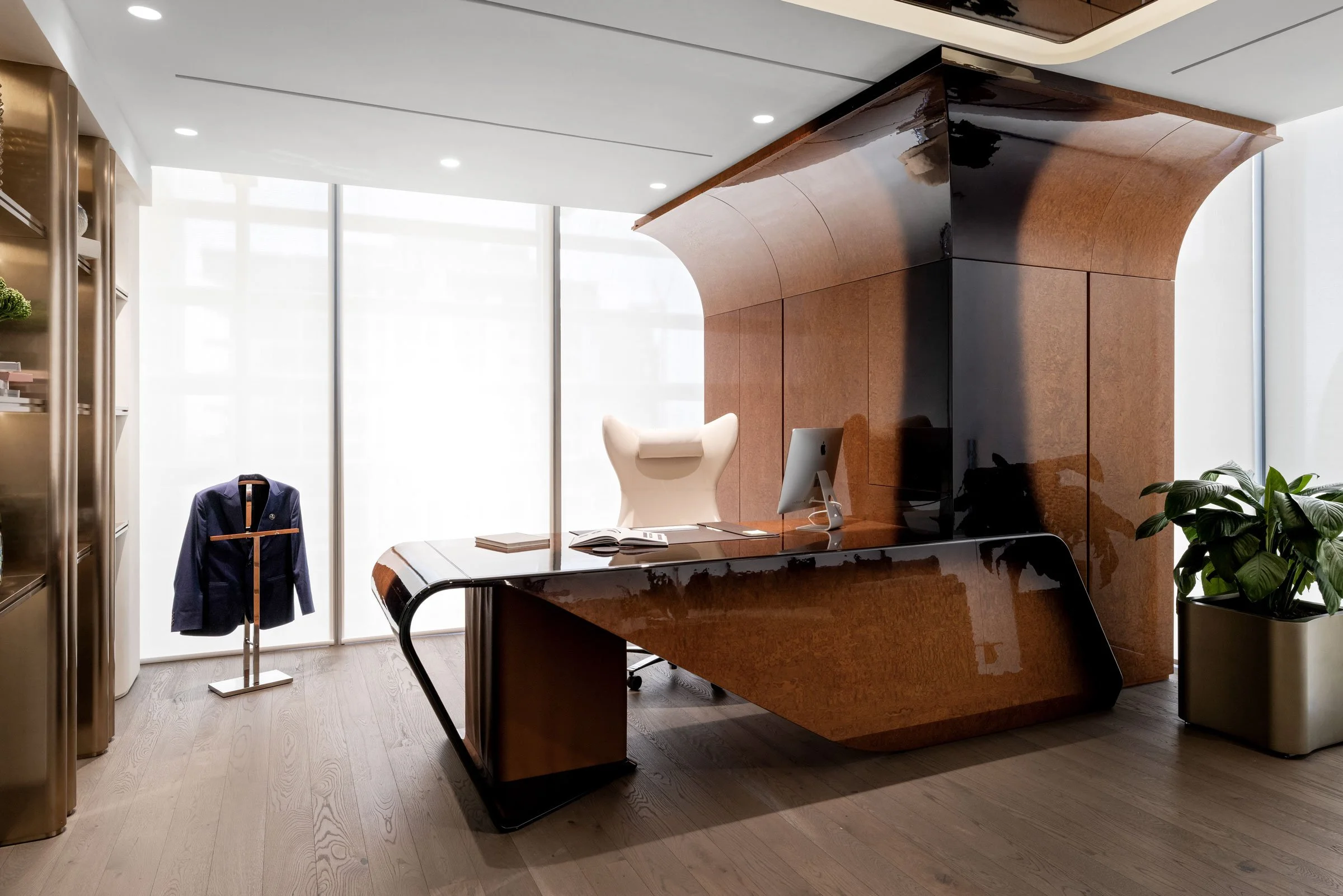 Contemporary executive office photographed in Dubai, highlighting bespoke desk design, rich wood finishes and refined commercial interiors.