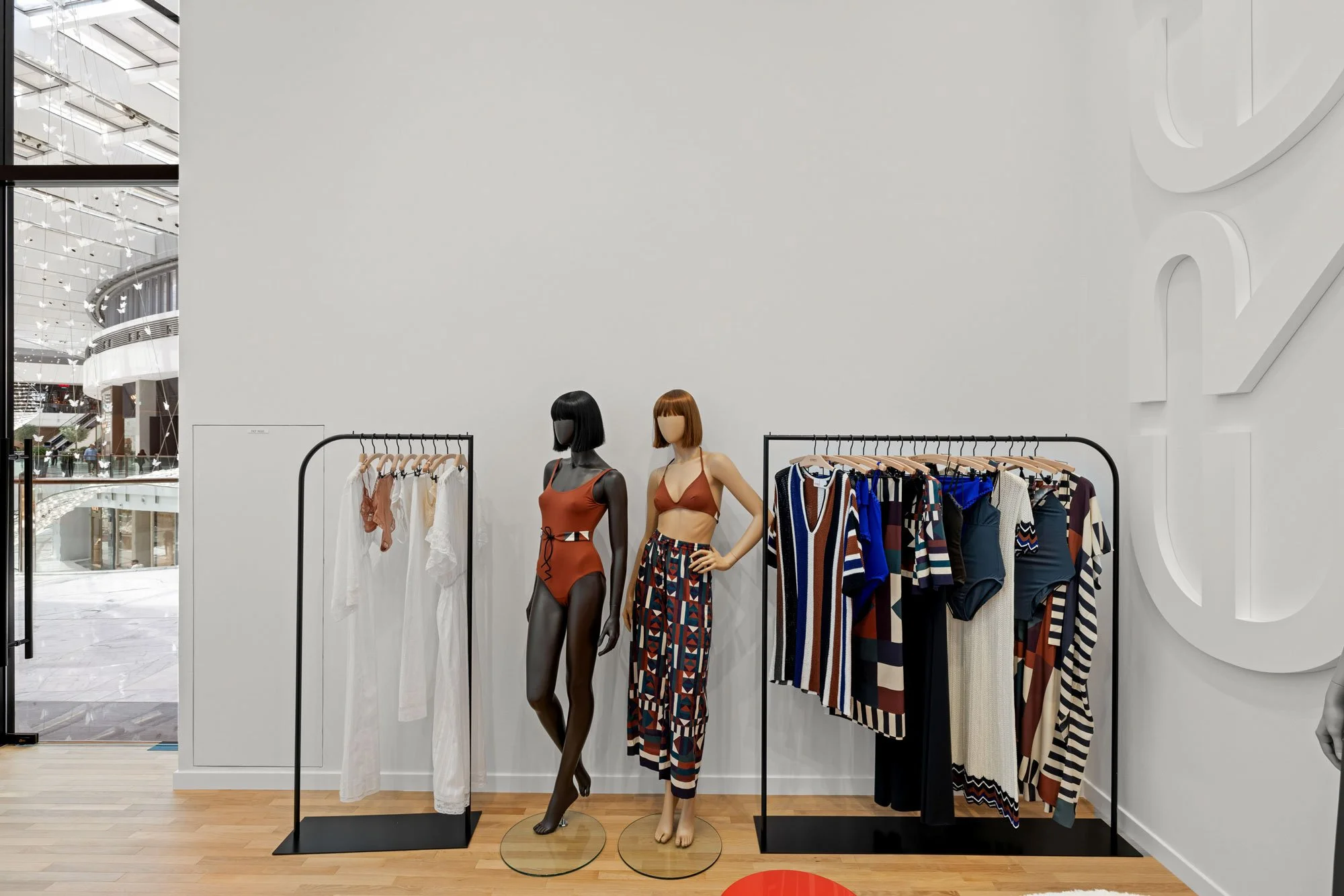 Luxury fashion boutique photography featuring contemporary retail interiors, premium product displays, and customer-focused shopping spaces.