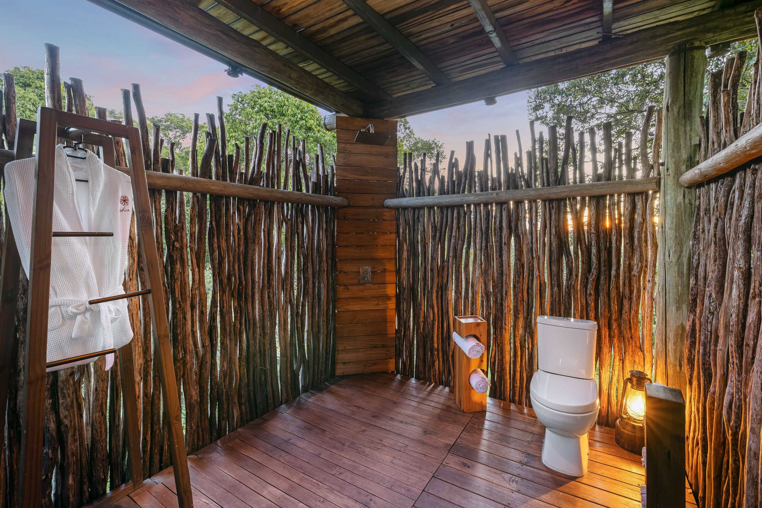 Luxury resort outdoor bathroom photography capturing unique hospitality design and natural materials.