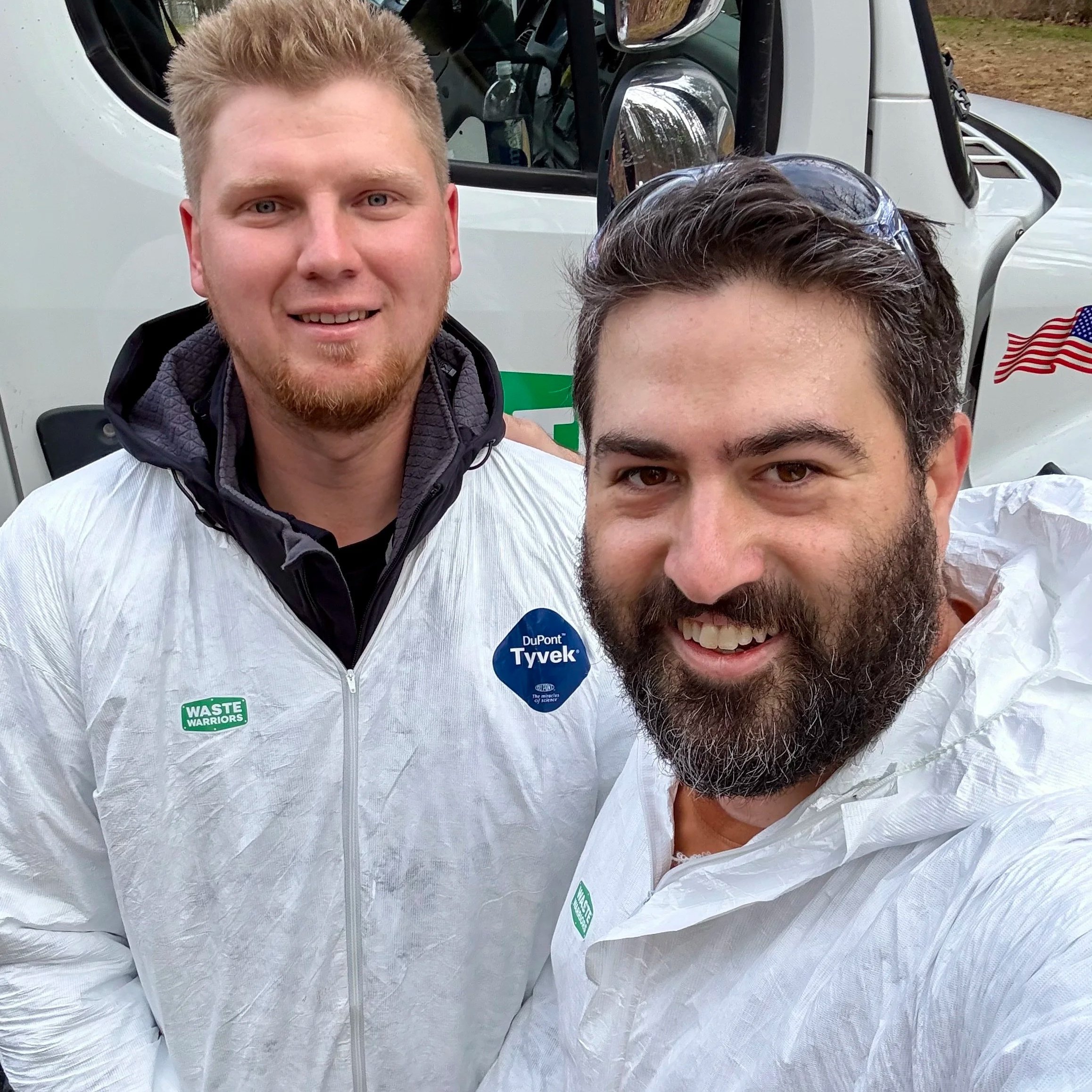 Two teammates from Waste Warriors after solving a septic emergency.
