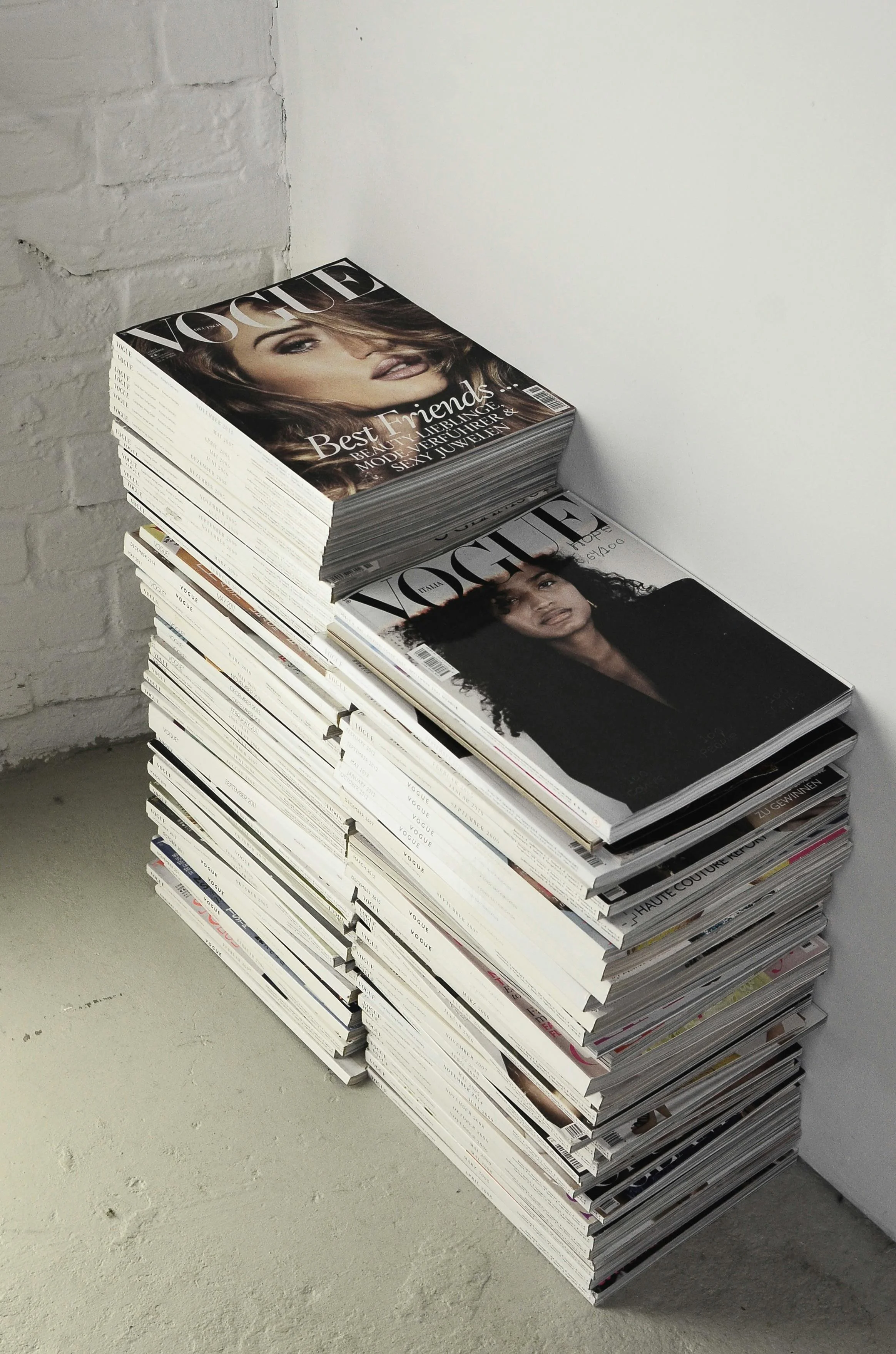Image of two stacks of Vogue Magazines