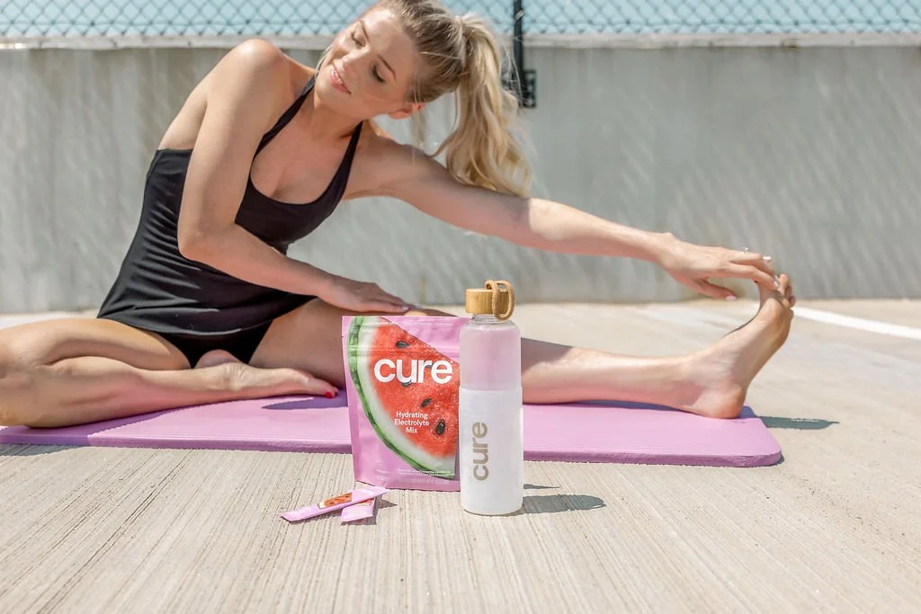 Image of Cure product in front of model doing Yoga