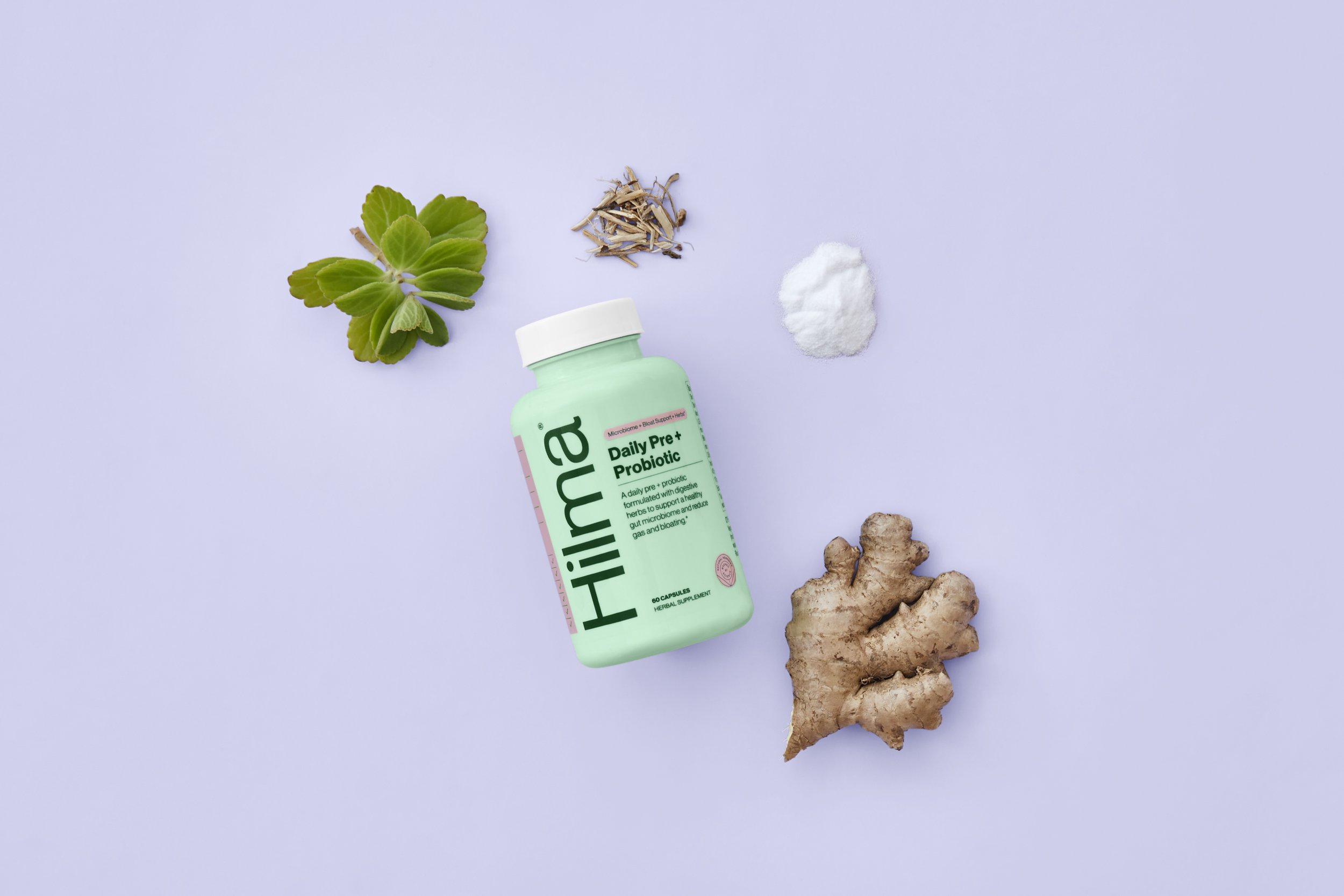Flatlay Image of Hilma product surrounded by ginger and other herbal ingredients