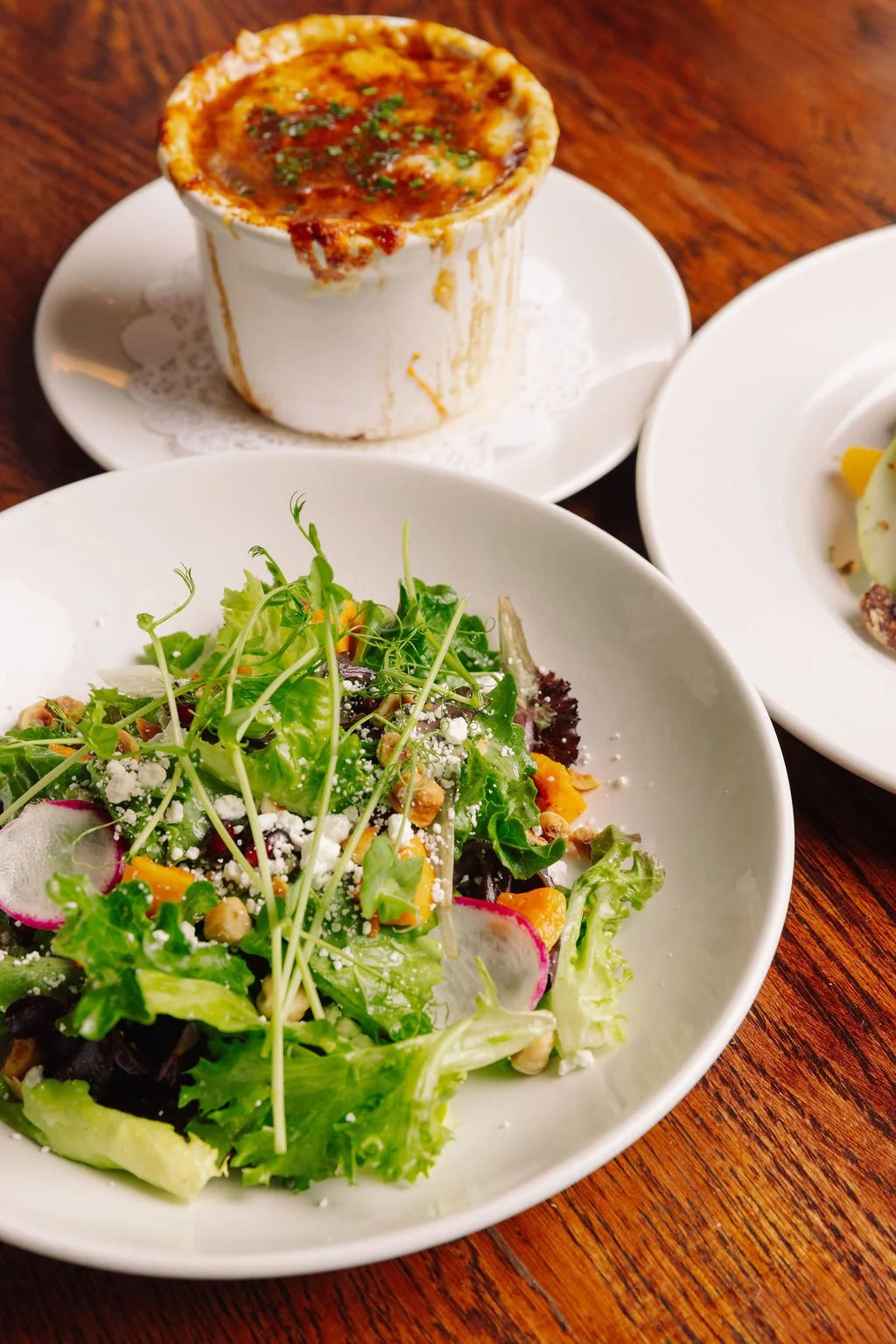 Mixed Lettuces (Butternut Squash, Pomegranate, Goat Cheese, Hazelnuts, Citrus Vinaigrette) and the Onion Soup Gratinée (Gruyère, Baguette)