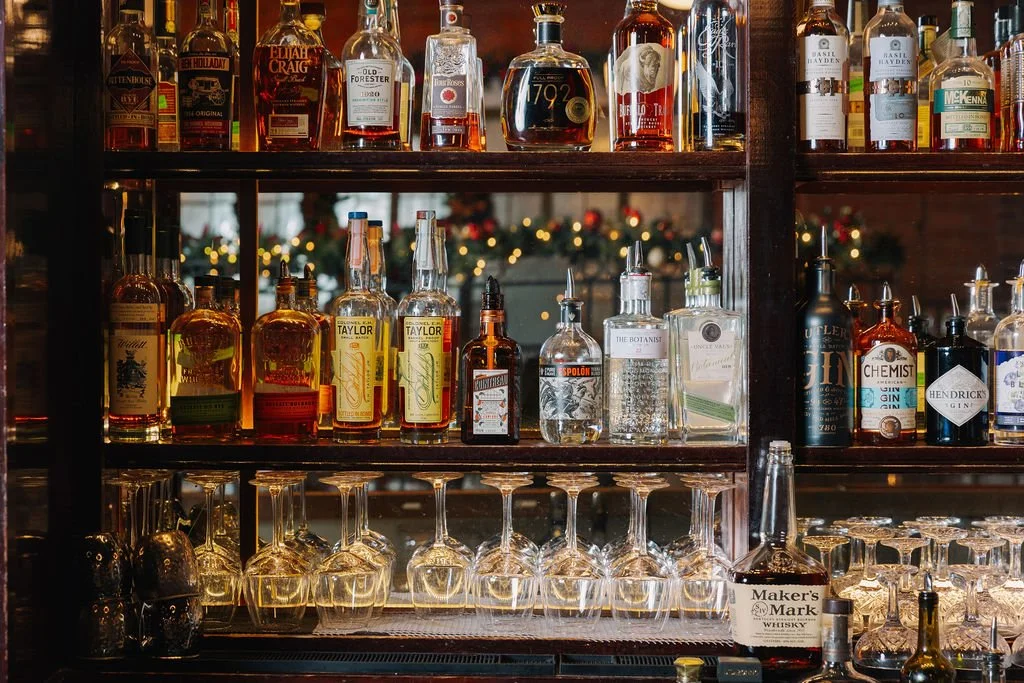 Backbar at Circa 1922. Our bar program features craft cocktails, an extensive curated wine list, and rotating beer list of domestic and craft selections
