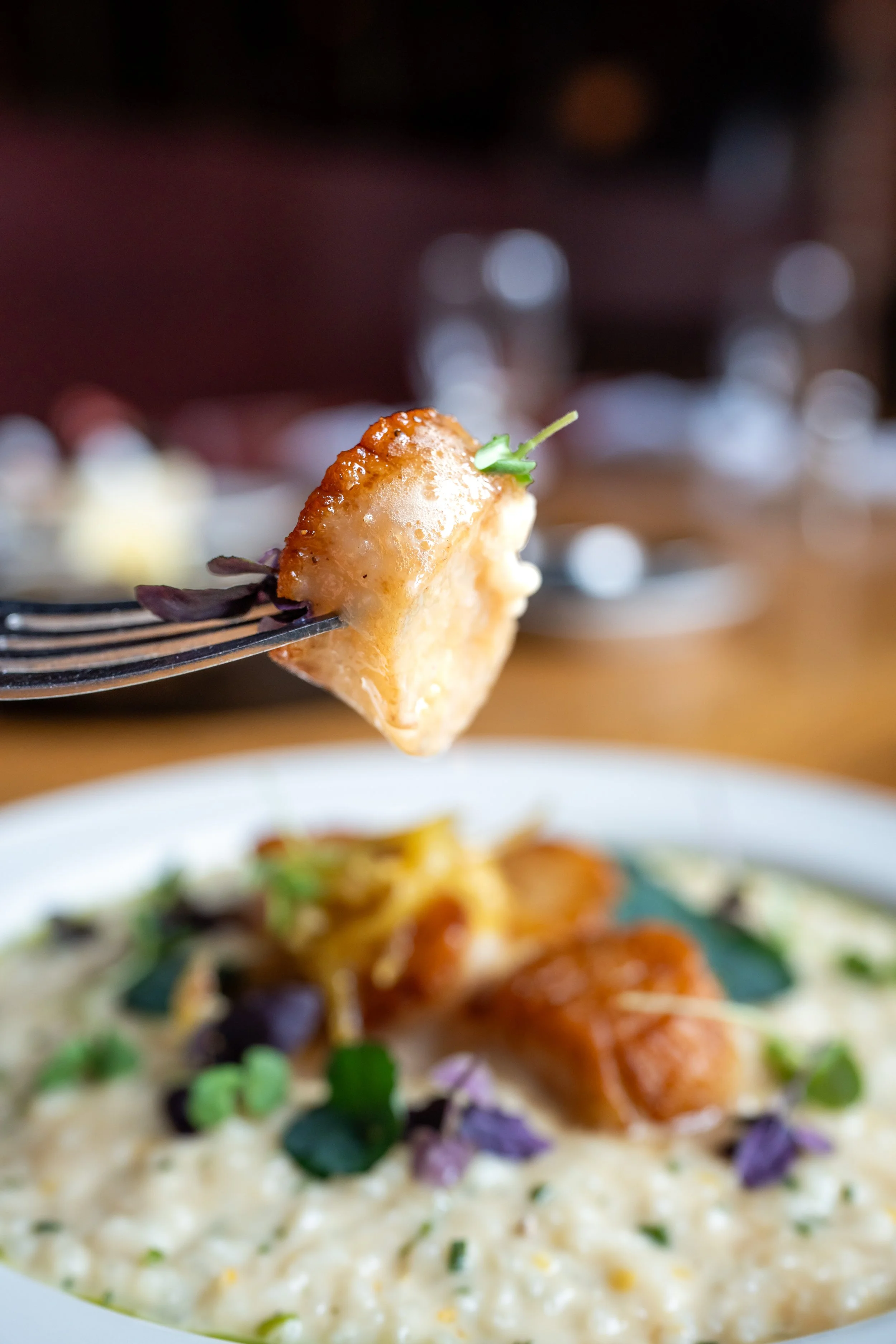 Scallops entree served with Melted Leeks & Celery Root, Kaluga Caviar.