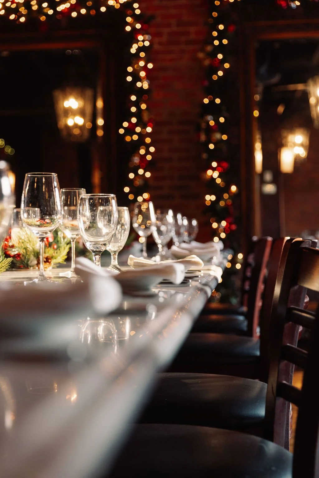 Place settings adorn the long table in the upstairs priviate dining room which comfortably seats 10 guests