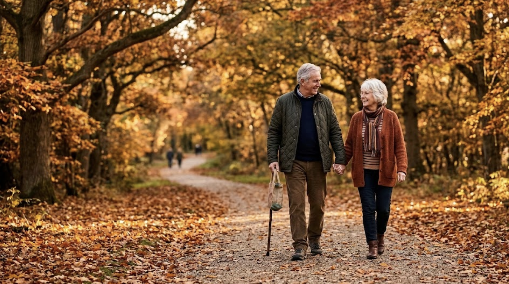 Senior couple walking together on a tree-lined path