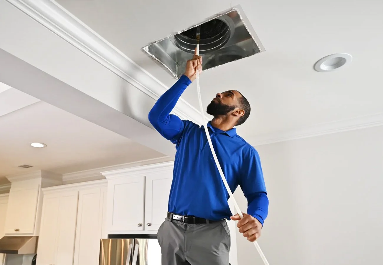 Trusted local HVAC company servicing home comfort systems in Redding CA preparing to install or repair a ventilation system.