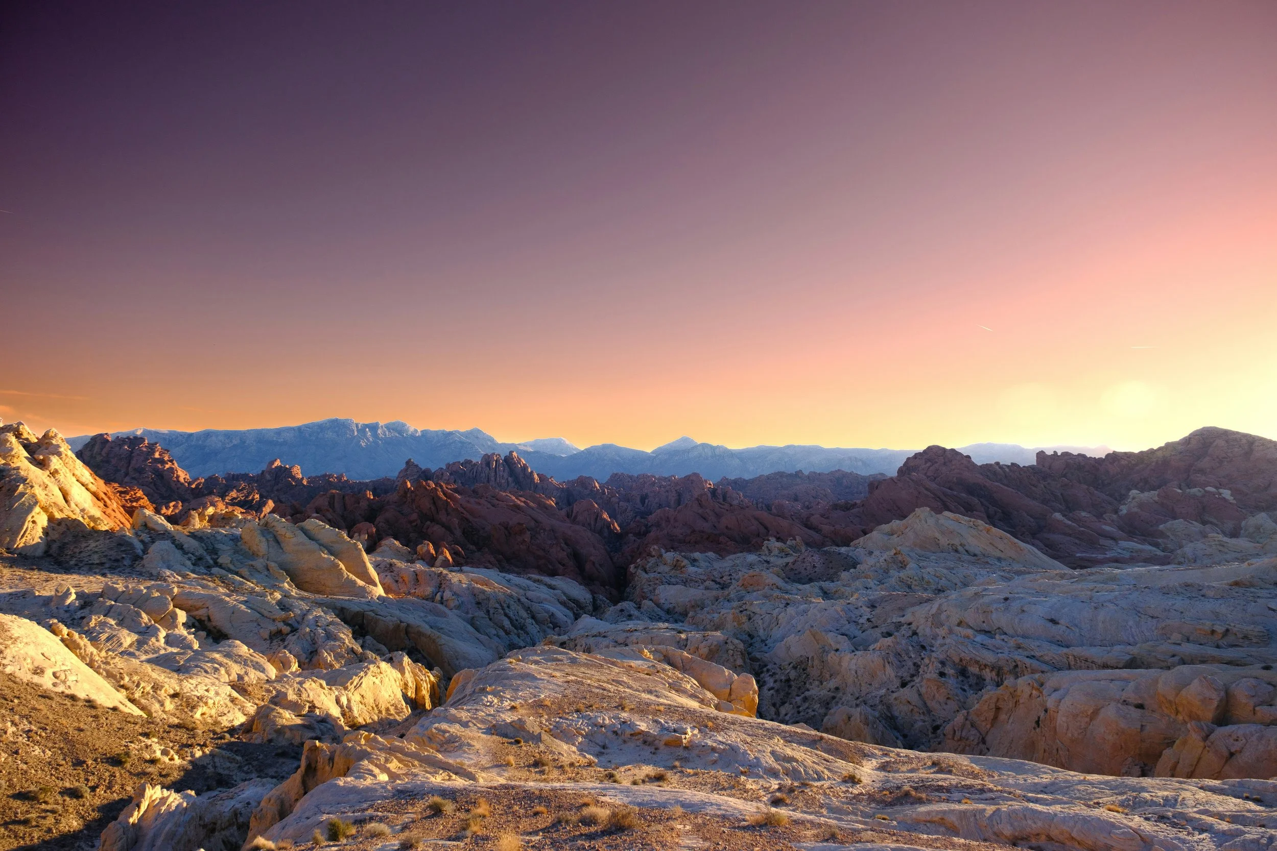 Desert mountains at sunrise symbolizing inspiration, prosperity, and leadership in luxury Nevada communities