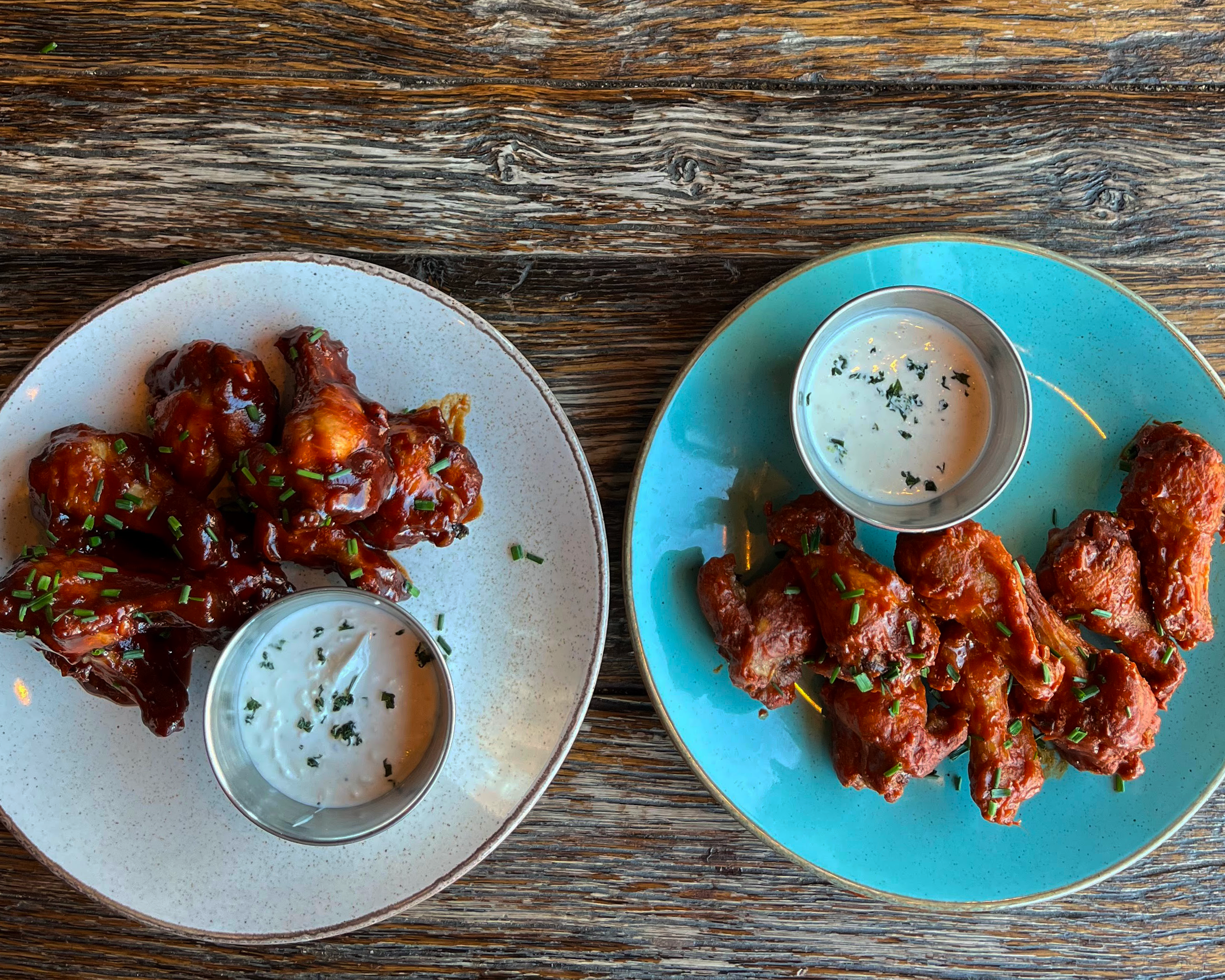 Chicken wings on a plate with dips