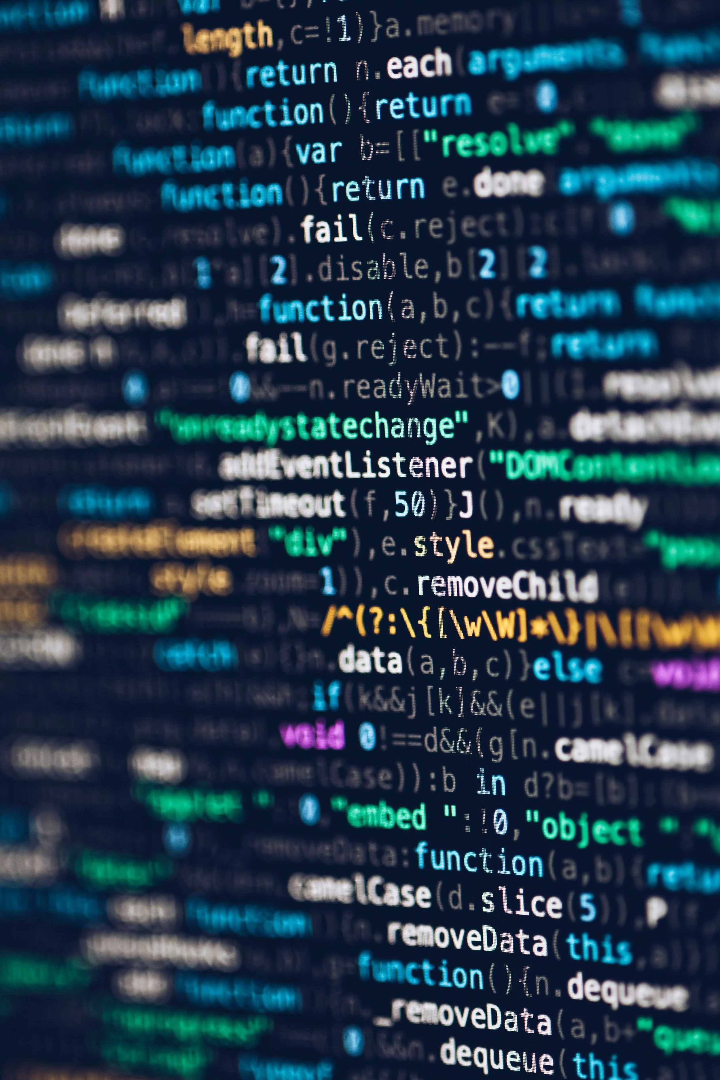 Close-up of a computer screen displaying colorful lines of programming code in JavaScript.