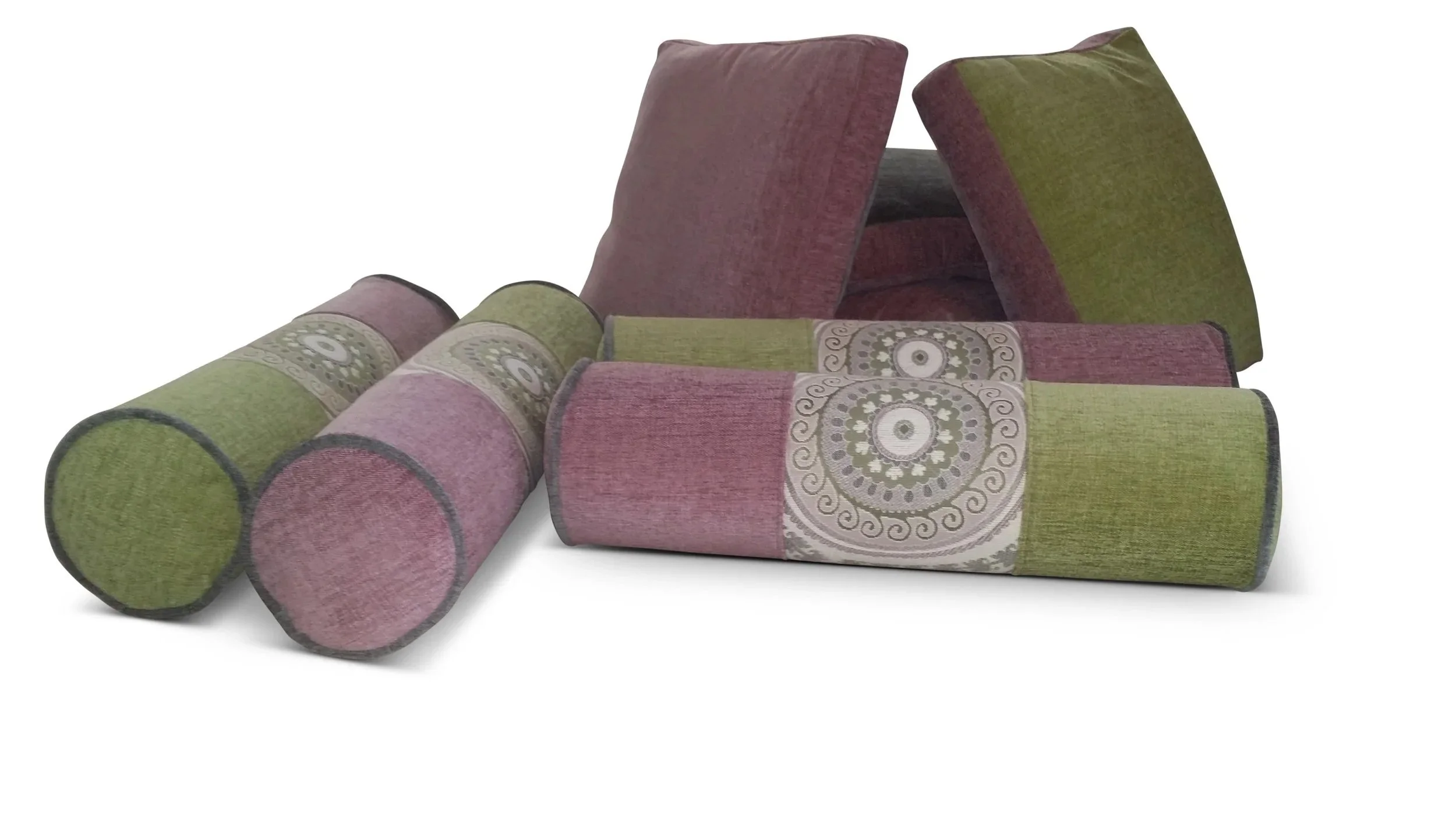Custom-designed bolsters in complementary tones, finished with detailed center-panel.
