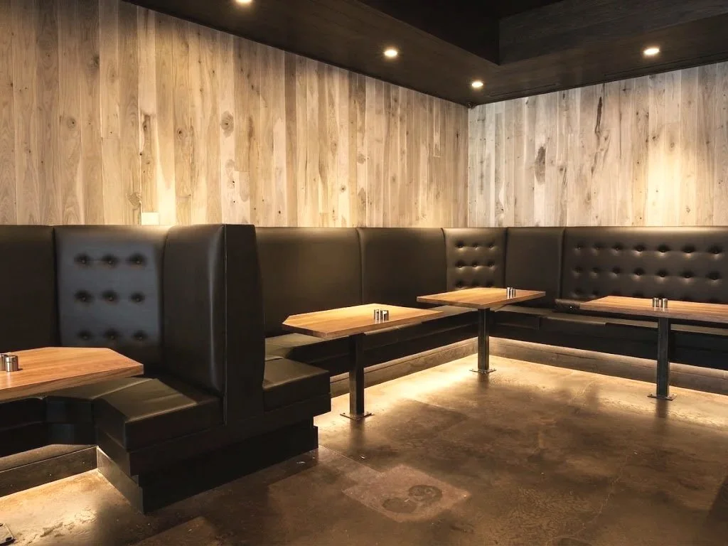 Custom commercial banquette booth seating upholstered for Milkmoney restaurant and coffee shop, crafted by London Stitchery.