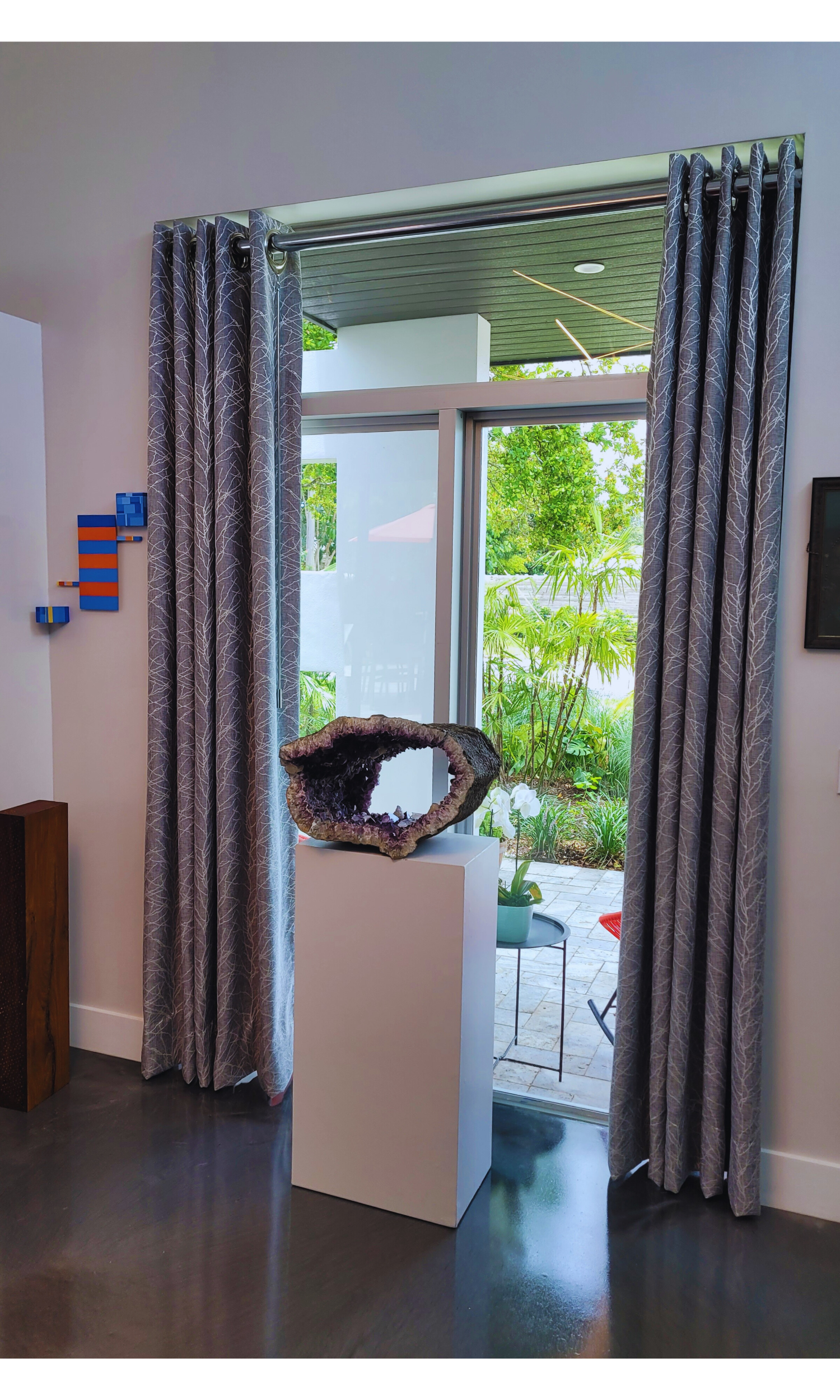Bespoke Silver Grommet Drapery: A sleek, modern window treatment solution handcrafted for a polished and functional interior.