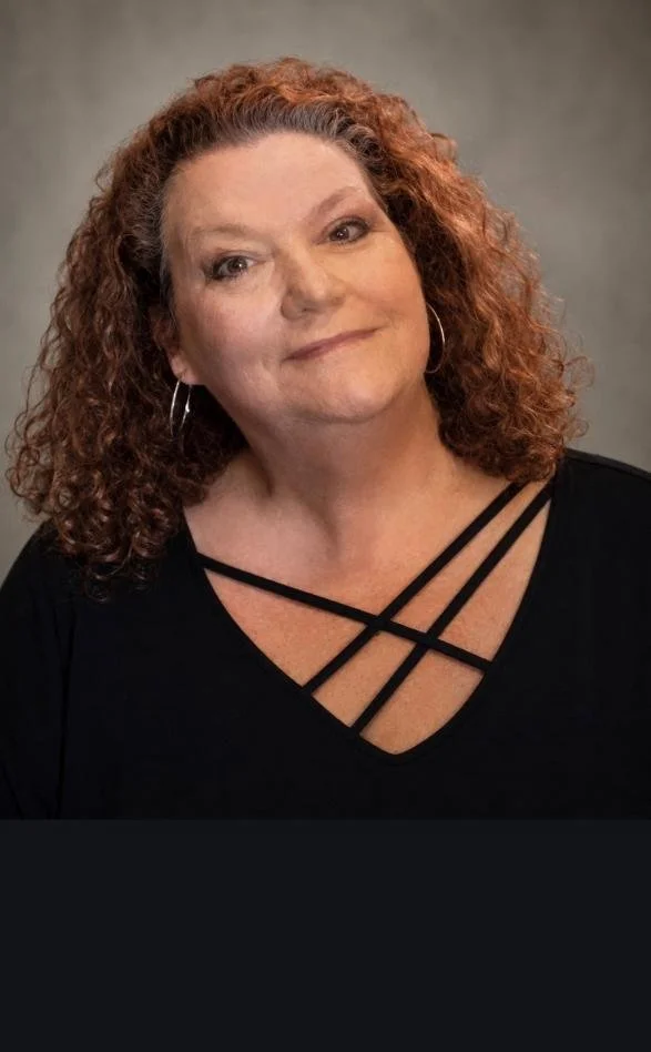 Portrait of Tracy Ryder, owner and custom specialist at London Stitchery, bringing over 22 years of expert craftsmanship in custom upholstery, luxury drapery, and interior design.