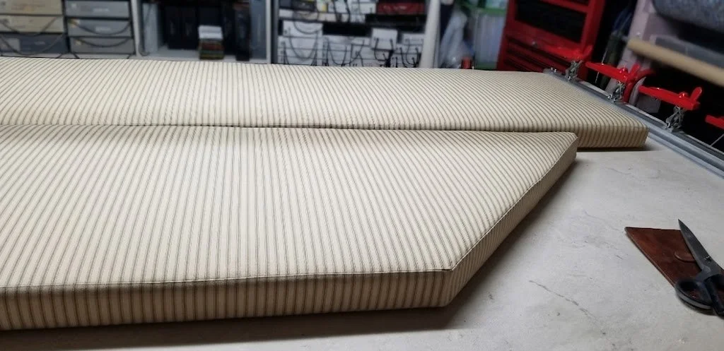Custom bench cushions featuring durable pillow ticking fabric with meticulously matched stripes for a seamless finish, tailored by London Stitchery.
