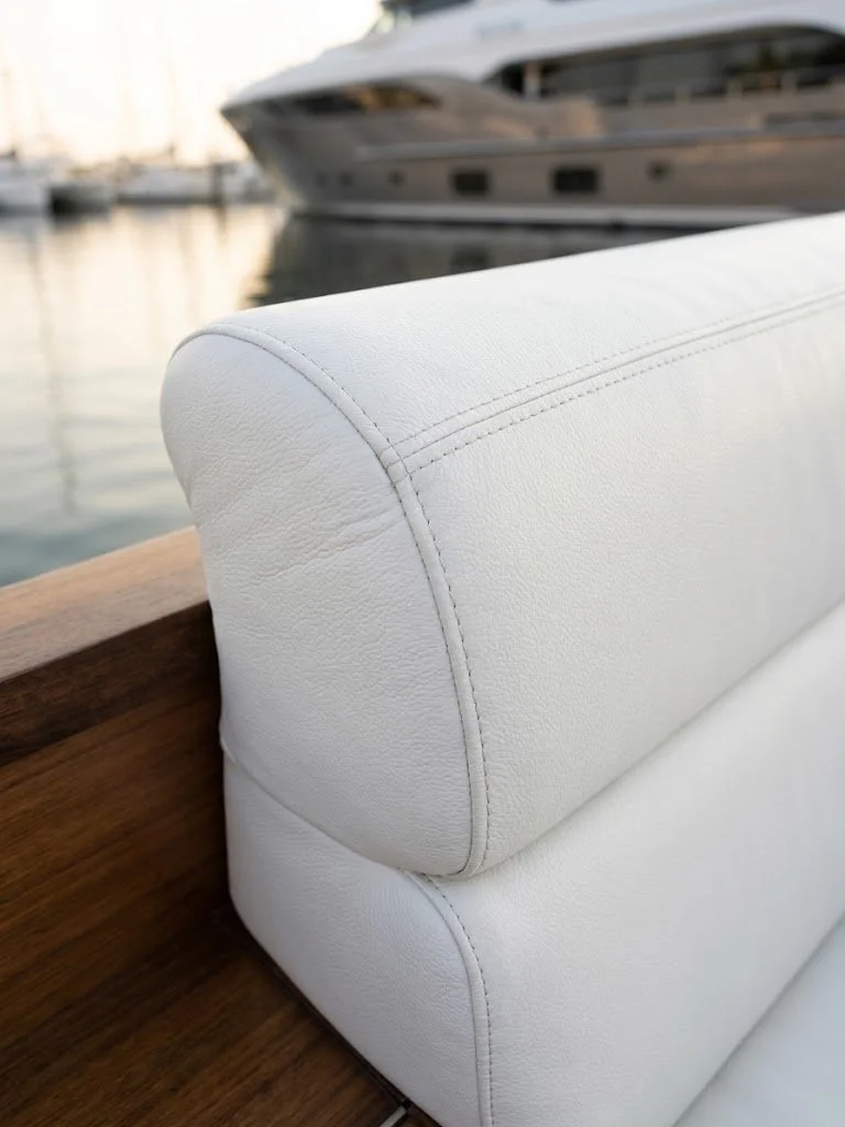 Custom white marine cockpit bolster cushion and yacht seating upholstery handcrafted in Fort Lauderdale by London Stitchery.