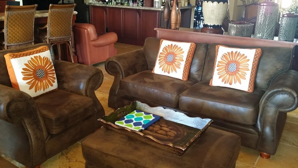 Hand-crafted decorative throw pillows featuring a vibrant sunflower motif with structured box-edge construction, tailored by London Stitchery.