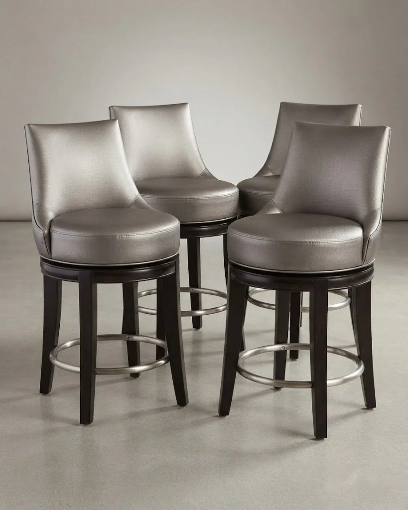Custom-upholstered bar stools finished in a sleek vegan leather with a metallic molten sheen, handcrafted by London Stitchery.