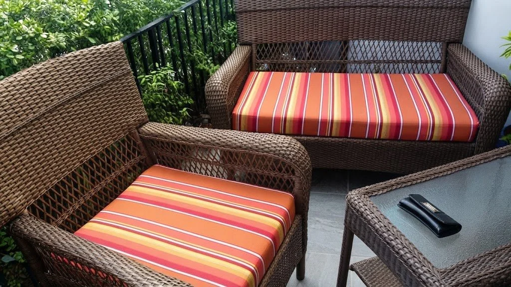 Custom-fitted outdoor patio furniture cushions featuring vibrant striped fabric with a precise pattern match, custom-crafted by London Stitchery 8 years ago.