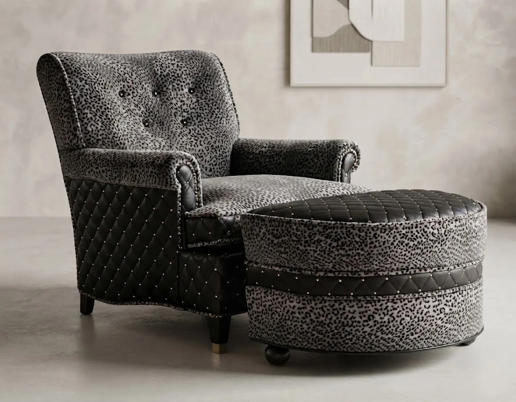 Custom accent armchair and matching ottoman upholstered in a striking mix of textured black and grey faux animal print, accented with sleek black vegan leather piping and detailing, handcrafted by London Stitchery.