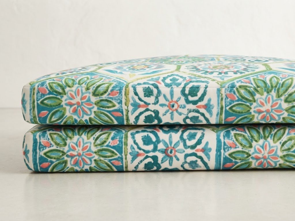 Custom-crafted outdoor cushions featuring a precise, seamless pattern match across dual cushions, designed and tailored by London Stitchery.