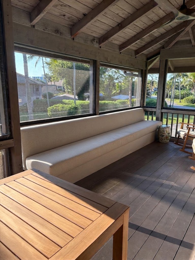 Extra-long custom outdoor bench cushions tailored to fit a covered patio seating area, crafted for weather durability by London Stitchery.
