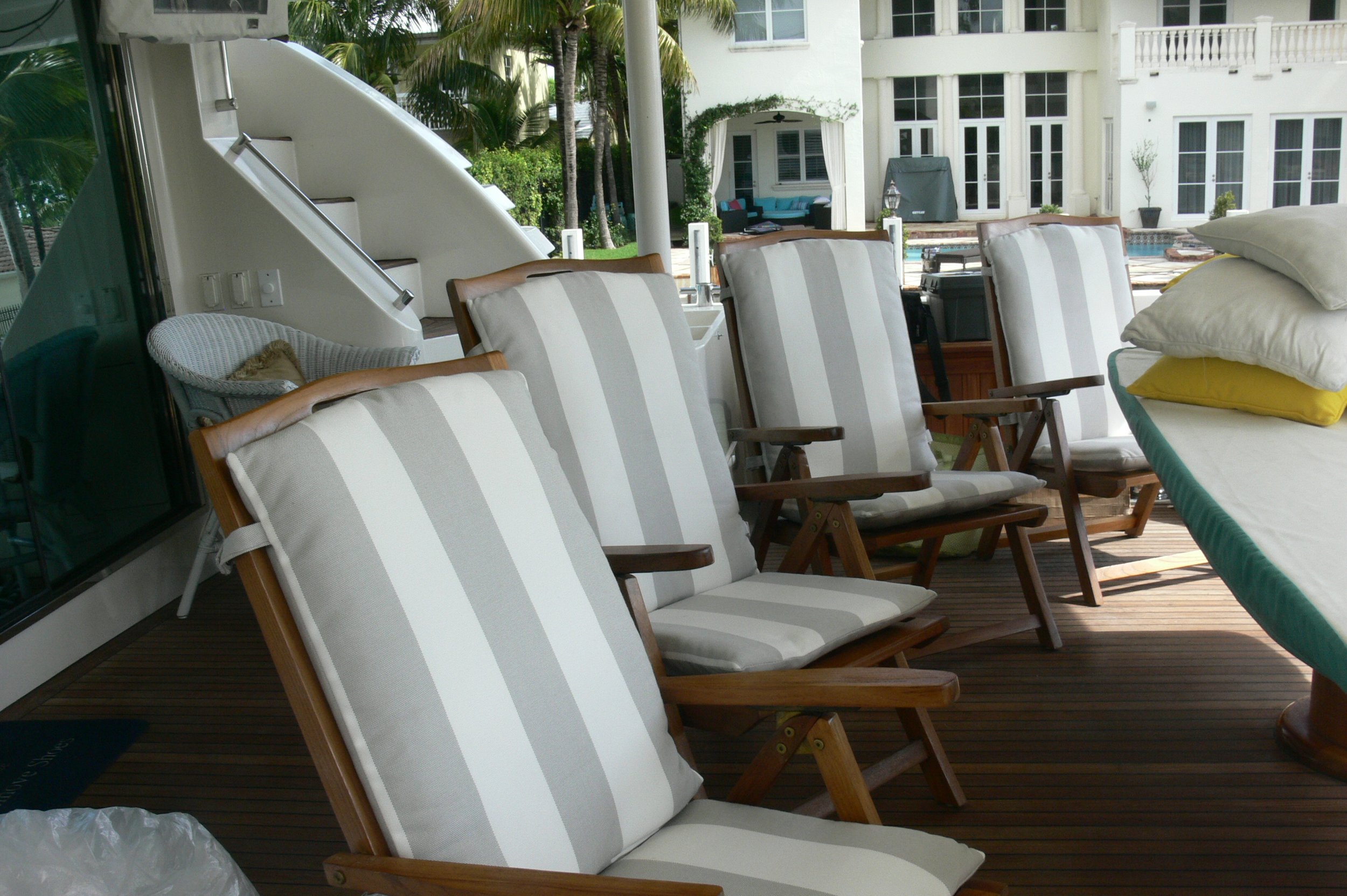 Custom Nautical Deck Chair Cushions: Expertly upholstered in premium striped outdoor Sunbrells fabric for a crisp, coordinated look.