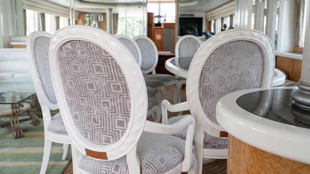 Custom reupholstered marine interior dining chairs with patterned fabric handcrafted in Fort Lauderdale by London Stitchery.