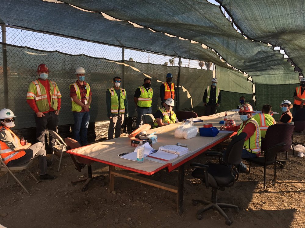 People gathered around a table reviewing information together