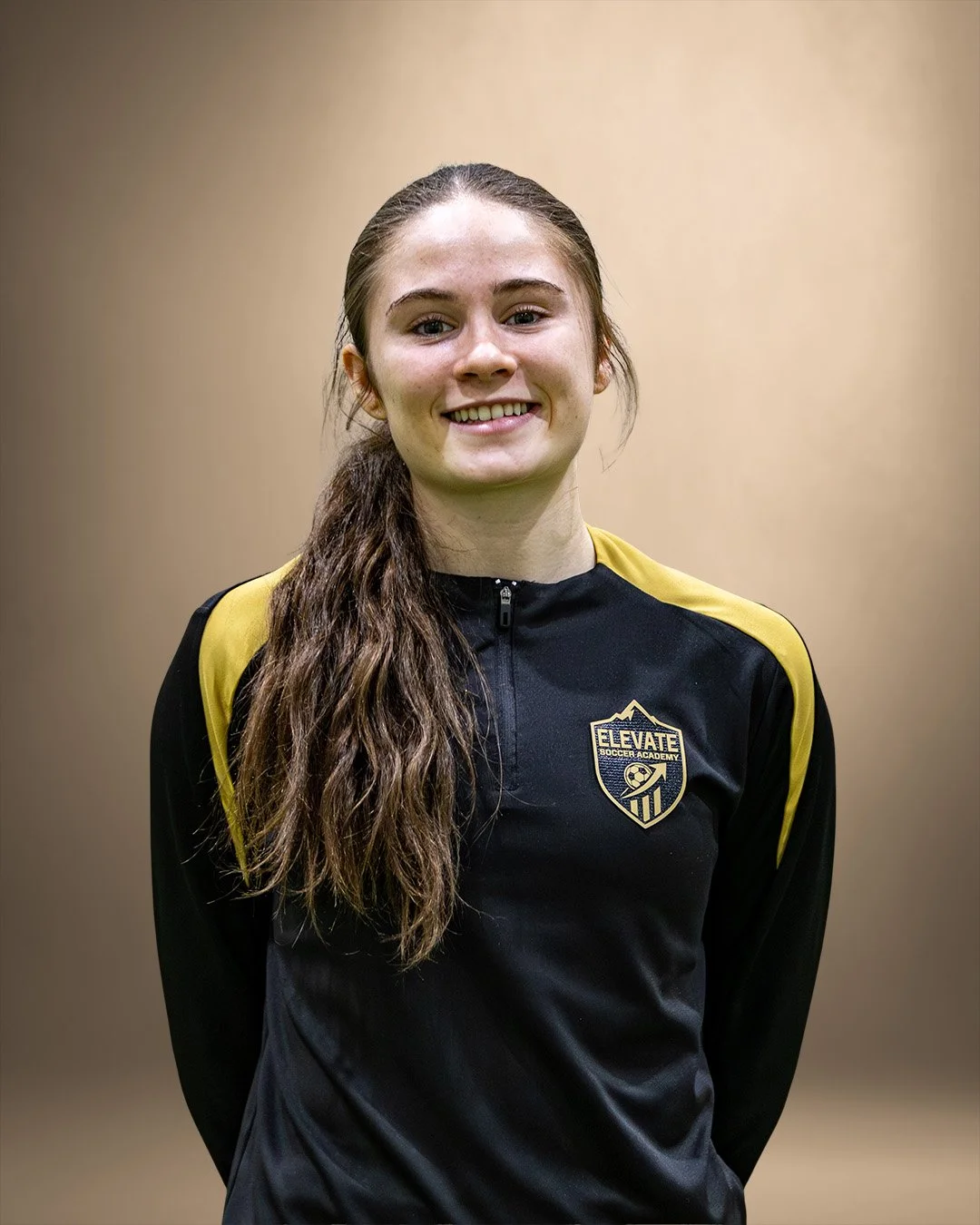 Clara Monck, soccer coach at Elevate Soccer Academy in Calgary, working with youth players on technical skills and confidence