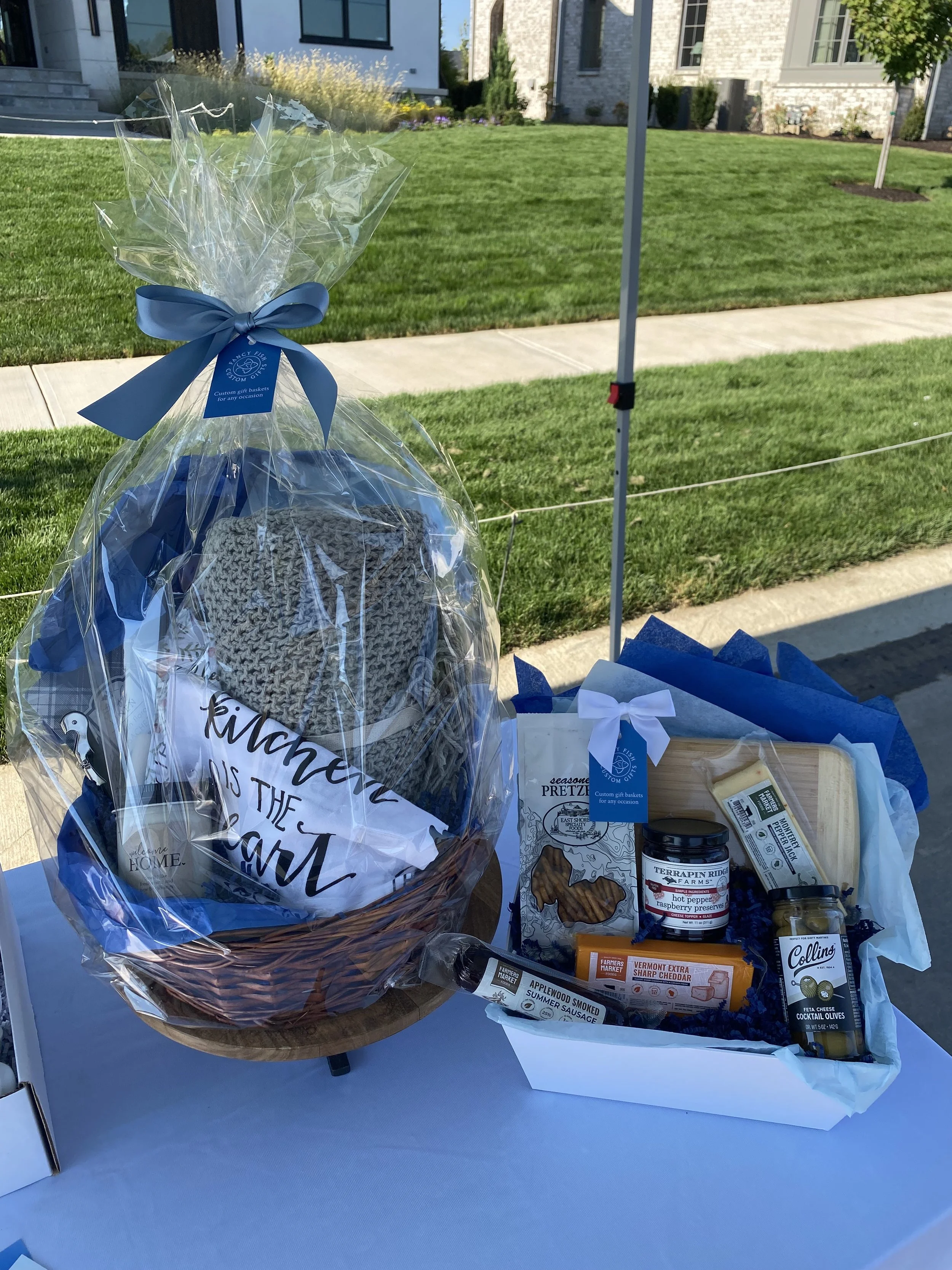 Charcuterie Gift Baskets can be filled with assorted gourmet foods including jams, cheeses, snacks and more.